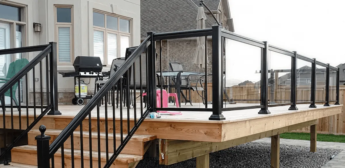 Handrail installation on a deck staircase for safety and code compliance in Arvada, CO